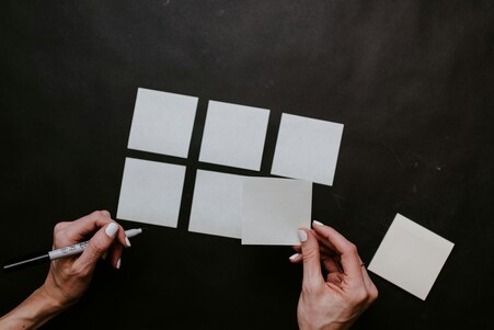 Top view of hands and post it notes